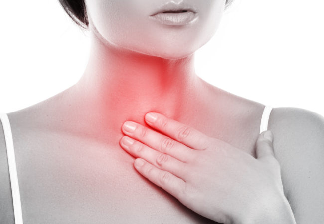 Root cause - woman pointing at throat